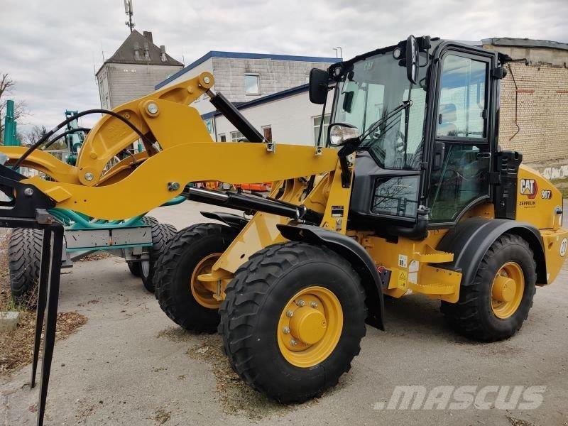 CAT 907 Iekrāvēji uz riteņiem