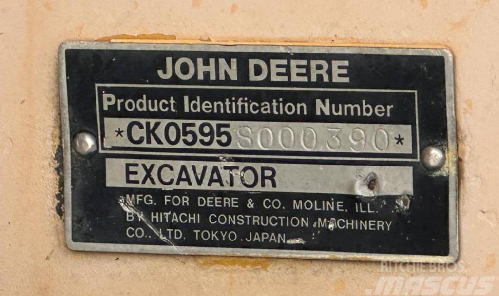 John Deere 595 Ekskavatori uz riteņiem