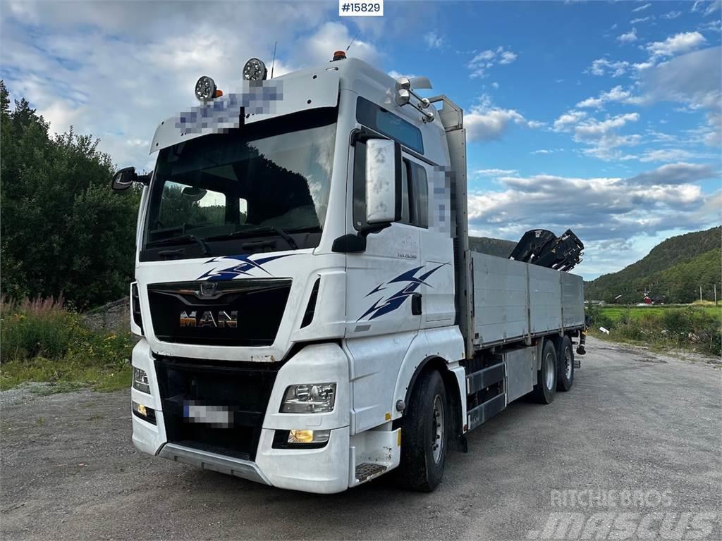 MAN TGX 26.560 Flatbed truck with Hiab 138 crane from  Platformas/izkraušana no sāniem