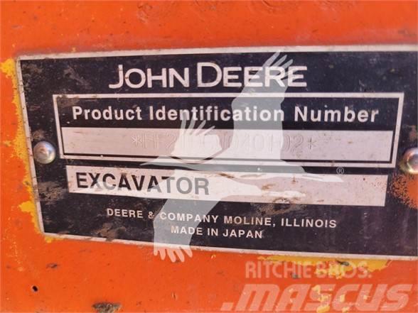 John Deere 210C W Ekskavatori uz riteņiem